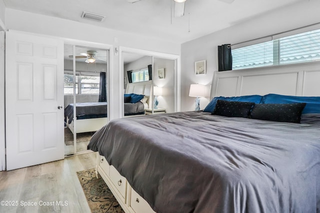 348 Berkeley St, Satellite Beach, FL 32937 - bedroom with multiple closets, light wood finished floors, and ceiling fan