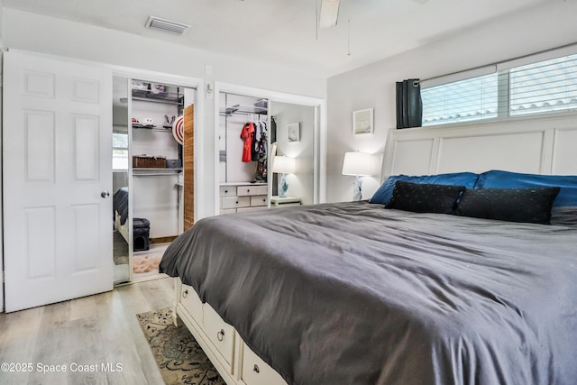 348 Berkeley St, Satellite Beach, FL 32937 - bedroom with light wood-style flooring and a ceiling fan