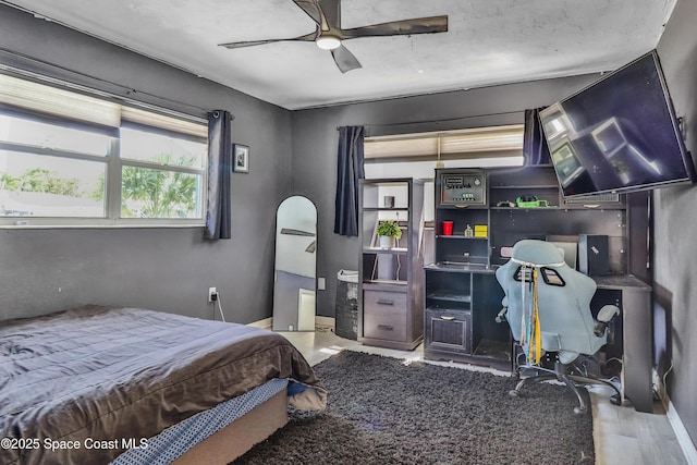 348 Berkeley St, Satellite Beach, FL 32937 - bedroom featuring wood finished floors and ceiling fan