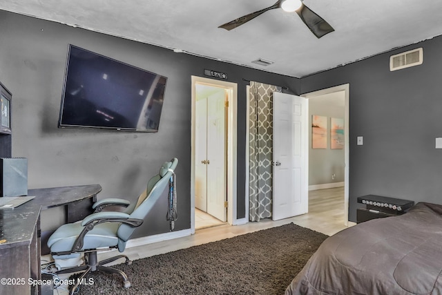 348 Berkeley St, Satellite Beach, FL 32937 - bedroom featuring wood finished floors, a ceiling fan, and a desk