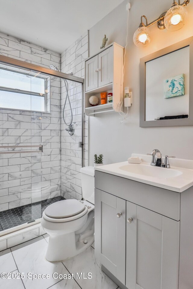 348 Berkeley St, Satellite Beach, FL 32937 - full bath featuring marble finish flooring, vanity, and a stall shower