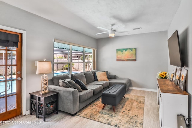 348 Berkeley St, Satellite Beach, FL 32937 - living area featuring ceiling fan and light wood-style floors