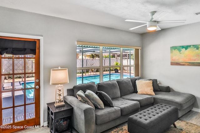 348 Berkeley St, Satellite Beach, FL 32937 - living area featuring ceiling fan and wood finished floors