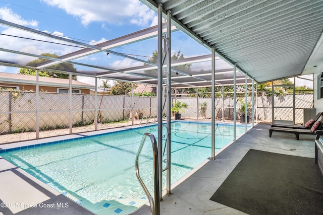 348 Berkeley St, Satellite Beach, FL 32937 - view of swimming pool with a fenced backyard, a patio, and glass enclosure