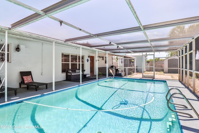 348 Berkeley St, Satellite Beach, FL 32937 - swimming pool with a storage unit, glass enclosure, and a patio