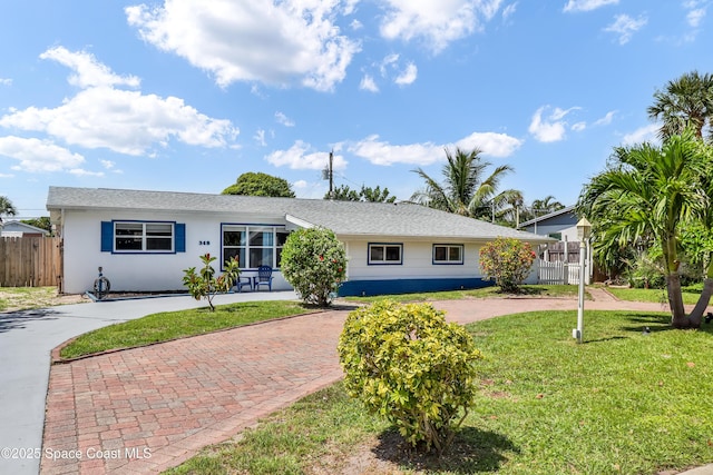 348 Berkeley St, Satellite Beach, FL 32937 - single story home featuring decorative driveway and stucco siding