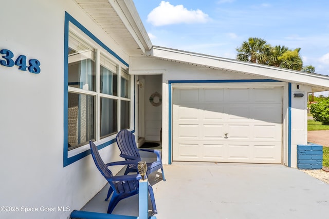 348 Berkeley St, Satellite Beach, FL 32937 - garage with concrete driveway