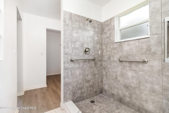 6856 Buxton Ave, Cocoa, FL 32927 - full bath with a tile shower and wood finished floors