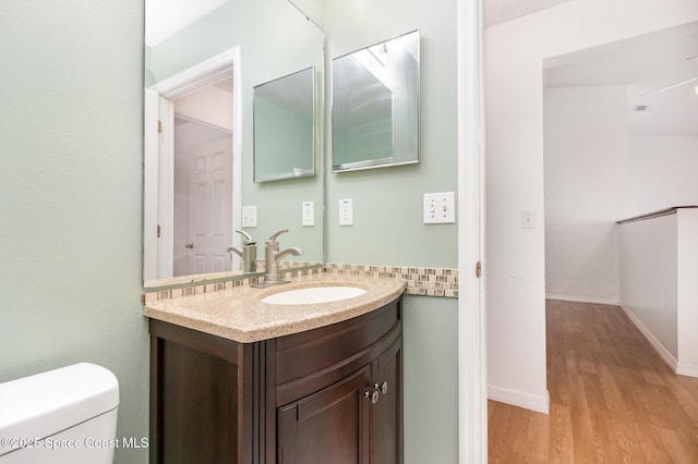 6856 Buxton Ave, Cocoa, FL 32927 - half bath featuring vanity and wood finished floors
