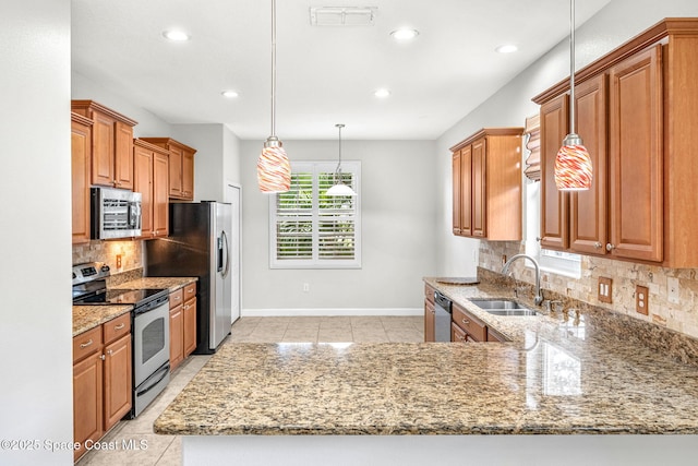 3654 Gurrero Dr, Melbourne, FL 32940 - kitchen with appliances with stainless steel finishes, light stone countertops, tasteful backsplash, recessed lighting, and brown cabinetry