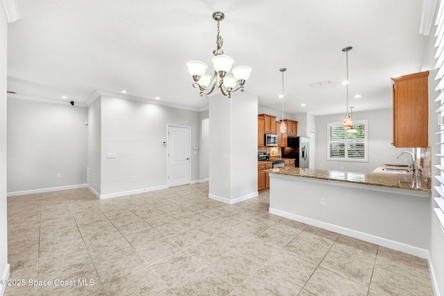 3654 Gurrero Dr, Melbourne, FL 32940 - kitchen with appliances with stainless steel finishes, brown cabinetry, light tile patterned floors, stone countertops, and a chandelier