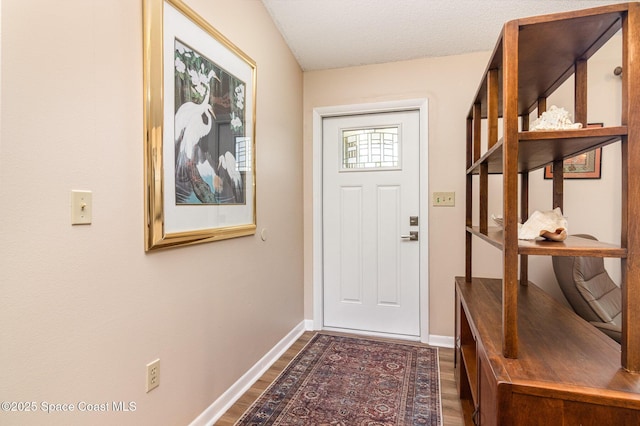 1265 Helias St NW, Palm Bay, FL 32907 - doorway featuring dark wood-style floors and baseboards