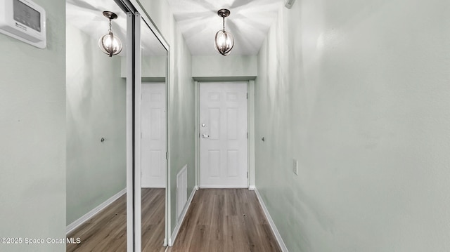 1420 Huntington Ln Unit 2405, Rockledge, FL 32955 - corridor featuring wood finished floors and baseboards