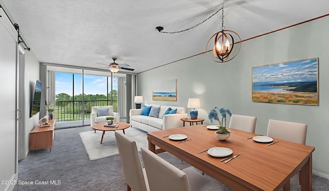 1420 Huntington Ln Unit 2405, Rockledge, FL 32955 - carpeted dining area with floor to ceiling windows, ceiling fan, a chandelier, and a textured ceiling