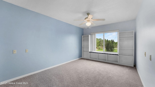 1420 Huntington Ln Unit 2405, Rockledge, FL 32955 - carpeted spare room featuring a ceiling fan and baseboards