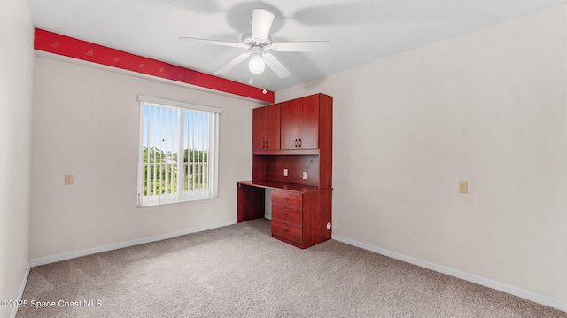 1420 Huntington Ln Unit 2405, Rockledge, FL 32955 - carpeted empty room with a ceiling fan and a desk