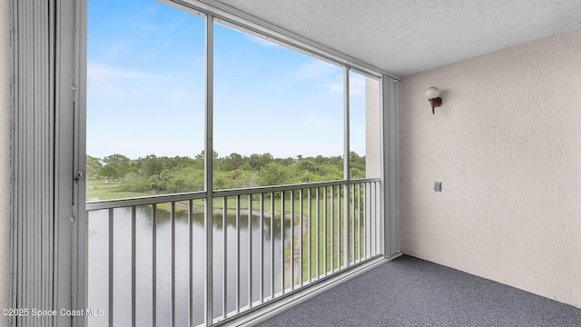 1420 Huntington Ln Unit 2405, Rockledge, FL 32955 - unfurnished sunroom with healthy amount of natural light and a water view