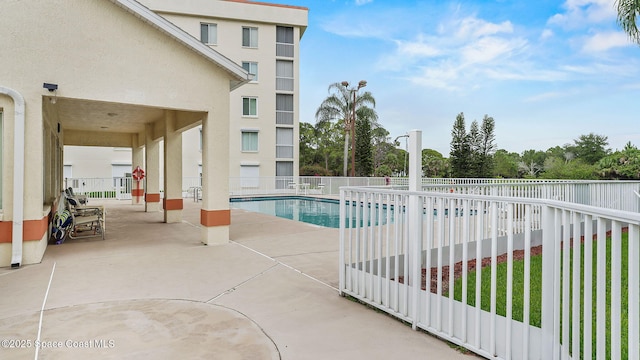 1420 Huntington Ln Unit 2405, Rockledge, FL 32955 - community pool featuring a patio