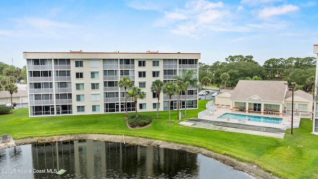 1420 Huntington Ln Unit 2405, Rockledge, FL 32955 - view of building exterior featuring a water view and a community pool