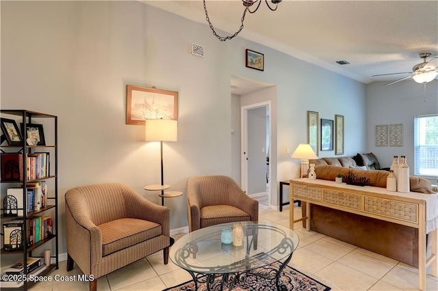 241 High Rd NW, Palm Bay, FL 32907 - living area with a ceiling fan, light tile patterned floors, and baseboards