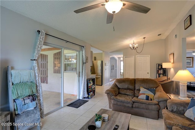 241 High Rd NW, Palm Bay, FL 32907 - living area featuring light tile patterned floors, a ceiling fan, arched walkways, a chandelier, and vaulted ceiling