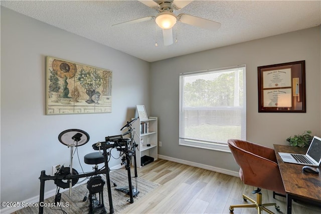 241 High Rd NW, Palm Bay, FL 32907 - office area with light wood finished floors, ceiling fan, baseboards, and a textured ceiling