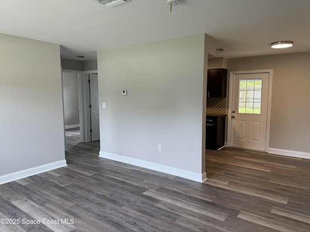 711 Sara Jane Ln, Merritt Island, FL 32952 - empty room with dark wood-style flooring and baseboards