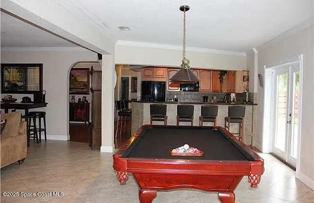22100 Serenata Cir W, Boca Raton, FL 33428 - recreation room with arched walkways, ornamental molding, billiards, and baseboards