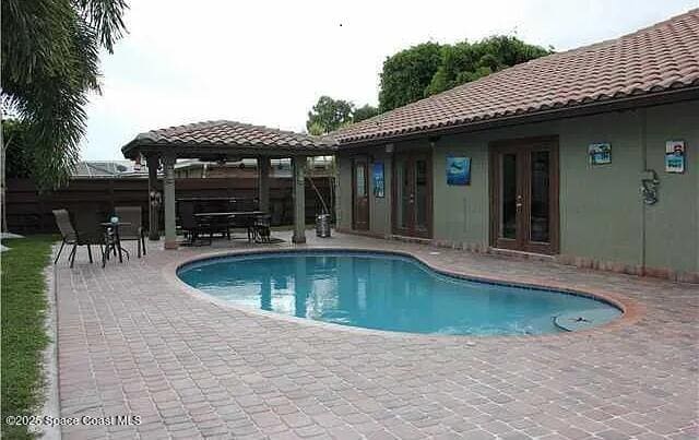 22100 Serenata Cir W, Boca Raton, FL 33428 - view of swimming pool with a gazebo, a patio, and french doors