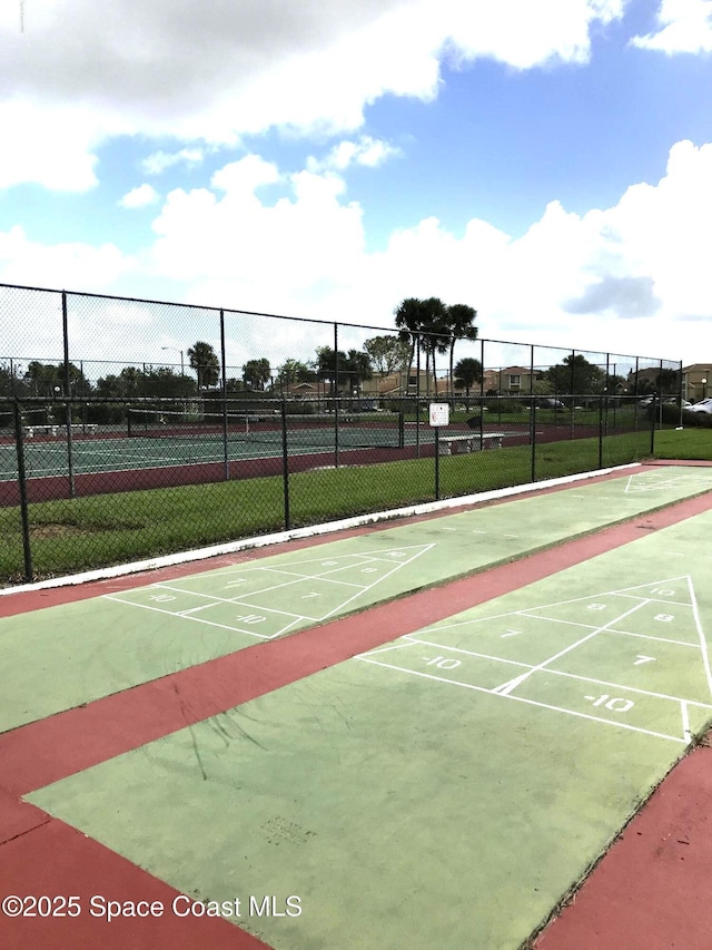 1470 Sheafe Ave NE Unit 108, Palm Bay, FL 32905 - surrounding community with a tennis court and shuffleboard