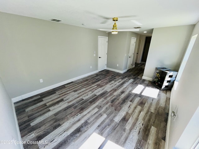 1271 Rabbit St SE, Palm Bay, FL 32909 - unfurnished living room with wood finished floors, a ceiling fan, and baseboards