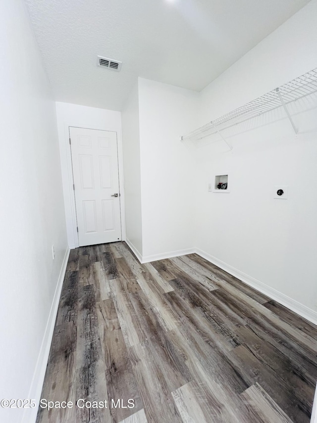 1271 Rabbit St SE, Palm Bay, FL 32909 - washroom with wood finished floors, hookup for a washing machine, baseboards, and electric dryer hookup
