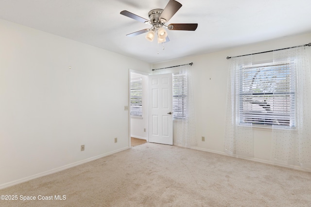 654 Centre Ct SW Unit 201, Vero Beach, FL 32962 - carpeted spare room with plenty of natural light, a ceiling fan, and baseboards