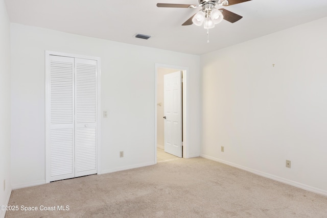 654 Centre Ct SW Unit 201, Vero Beach, FL 32962 - unfurnished bedroom featuring carpet floors, baseboards, and a closet