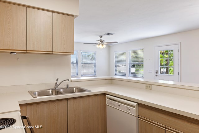 654 Centre Ct SW Unit 201, Vero Beach, FL 32962 - kitchen featuring white dishwasher, a sink, light brown cabinetry, and light countertops