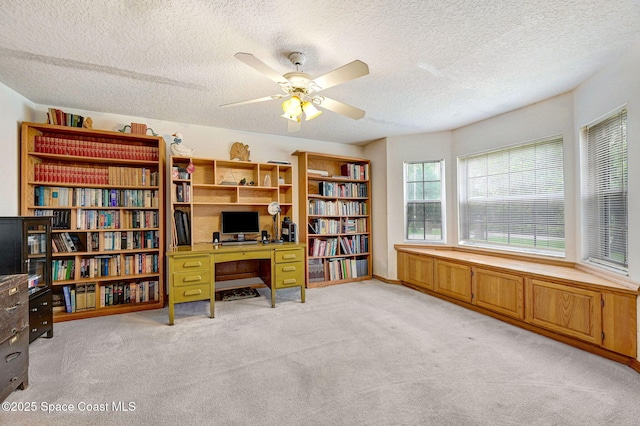 2575 Cox Rd, Cocoa, FL 32926 - office with light carpet, a ceiling fan, and a textured ceiling