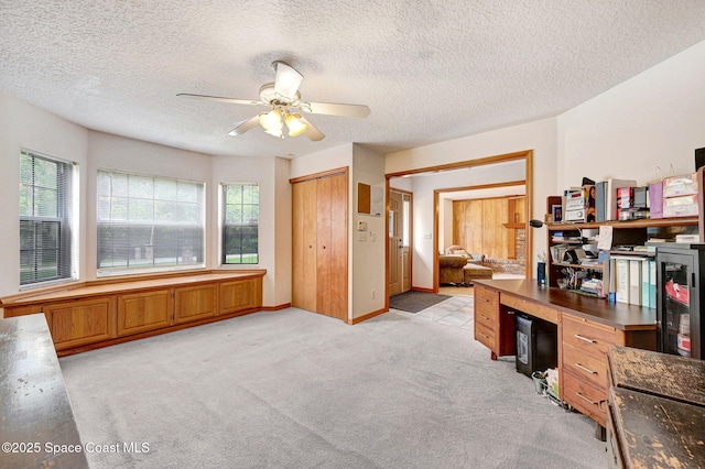 2575 Cox Rd, Cocoa, FL 32926 - office with a ceiling fan, light colored carpet, and a textured ceiling