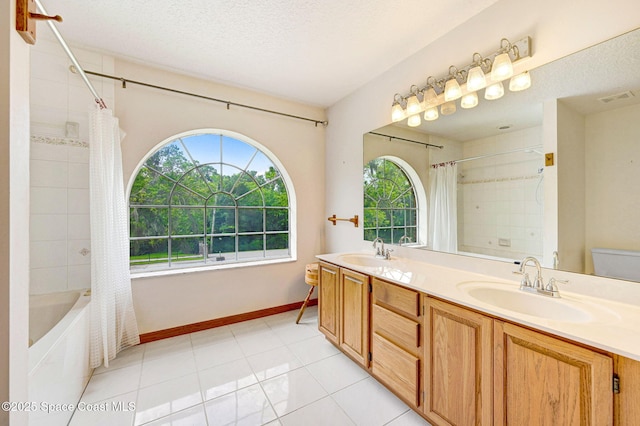 2575 Cox Rd, Cocoa, FL 32926 - full bath with shower / bathtub combination with curtain, double vanity, tile patterned flooring, and a textured ceiling