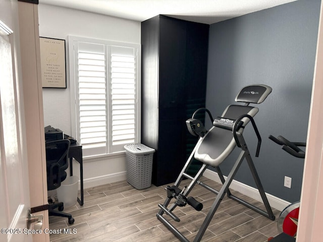 259 Wilton Ave SW, Palm Bay, FL 32908 - exercise area with baseboards and wood finished floors