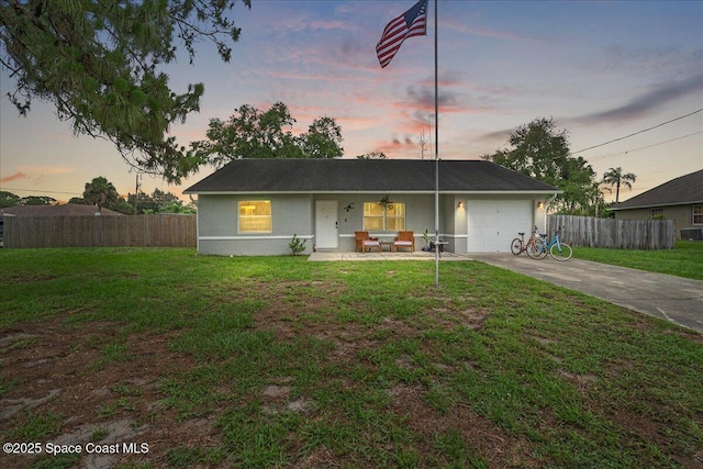 5997 Jenkins Ave, Cocoa, FL 32927 - ranch-style house featuring concrete driveway, a porch, an attached garage, and stucco siding