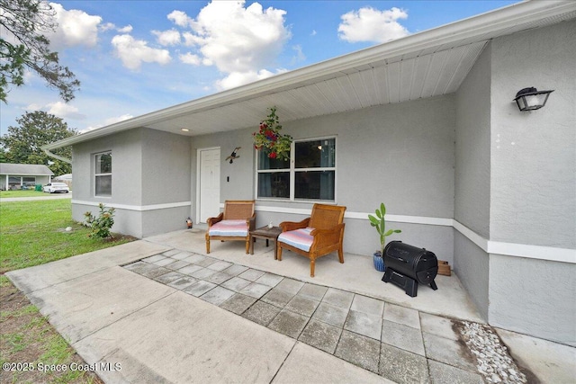 5997 Jenkins Ave, Cocoa, FL 32927 - porch featuring a yard and a patio