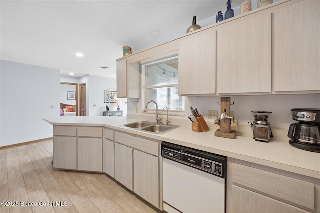 5997 Jenkins Ave, Cocoa, FL 32927 - kitchen with dishwasher, light countertops, a peninsula, light brown cabinetry, and recessed lighting