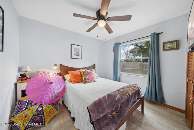 5997 Jenkins Ave, Cocoa, FL 32927 - bedroom featuring wood finished floors and ceiling fan