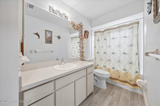 5997 Jenkins Ave, Cocoa, FL 32927 - full bathroom with vanity, wood finished floors, and shower / tub combo