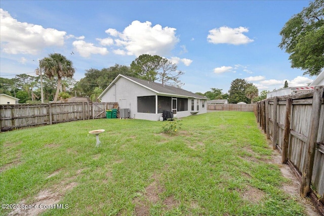 5997 Jenkins Ave, Cocoa, FL 32927 - fenced backyard with a sunroom