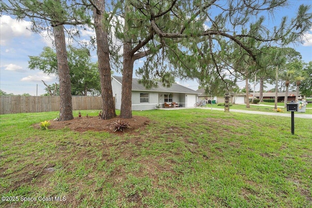 5997 Jenkins Ave, Cocoa, FL 32927 - view of front facade featuring stucco siding and a garage
