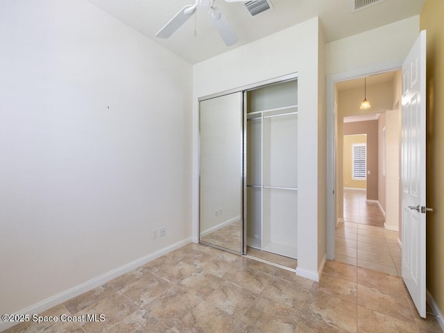 5422 Barbados Sq, Vero Beach, FL 32967 - unfurnished bedroom with a closet, tile patterned floors, and baseboards
