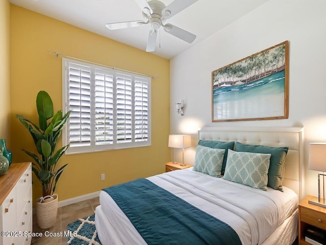 5422 Barbados Sq, Vero Beach, FL 32967 - tiled bedroom featuring baseboards and a ceiling fan
