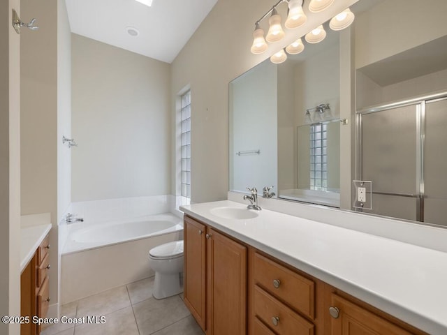 5422 Barbados Sq, Vero Beach, FL 32967 - full bathroom featuring vanity, a garden tub, a shower stall, and tile patterned floors