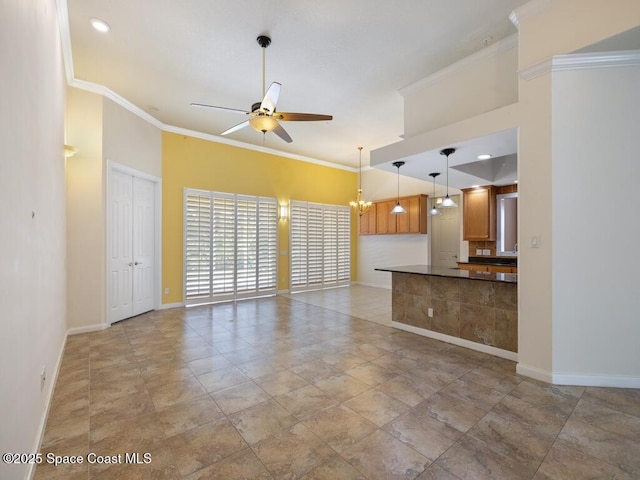 5422 Barbados Sq, Vero Beach, FL 32967 - unfurnished living room with baseboards, ceiling fan, ornamental molding, recessed lighting, and a chandelier